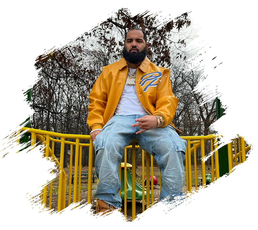 man in a yellow jacket sitting on a yellow playground equipment railing